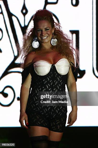 Cuban actress Liz Vega walks the runway during the fashion show of Mexican designer Artemiza Cruz for La Vill on March 24, 2010 in Mexico City....