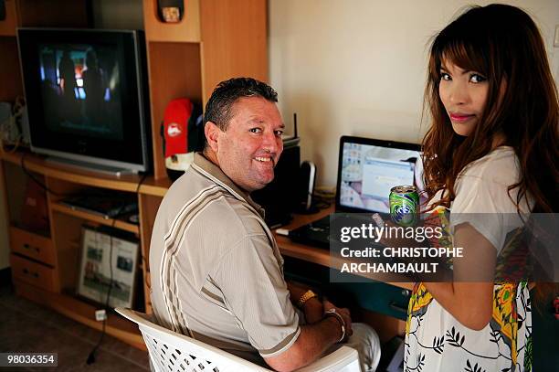 Thailand-society-marriage-Western-lifestyle,FEATURE by Rachel O'BRIEN This picture taken on January 13, 2010 shows Australian man Justin Raines and...