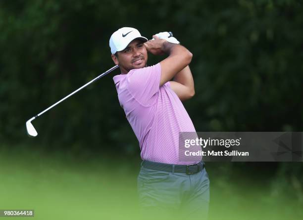 Jason Day of Australia watches his tee shot on the 12th hole during the first round of the Travelers Championship at TPC River Highlands on June 21,...