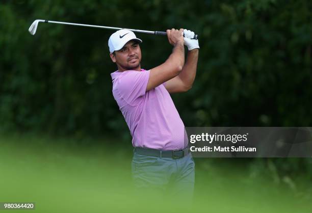 Jason Day of Australia watches his tee shot on the 12th hole during the first round of the Travelers Championship at TPC River Highlands on June 21,...