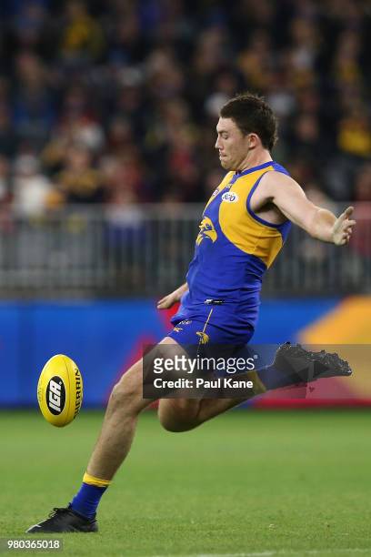 Jeremy McGovern of the Eagles kicks the ball during the round 14 AFL match between the West Coast Eagles and the Essendon Bombers at Optus Stadium on...
