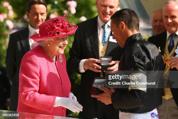 Queen Elizabeth II presents Frankie Dettori with his award for winning The Gold Cup on day 3 of Royal Ascot at Ascot Racecourse on June 21, 2018 in...