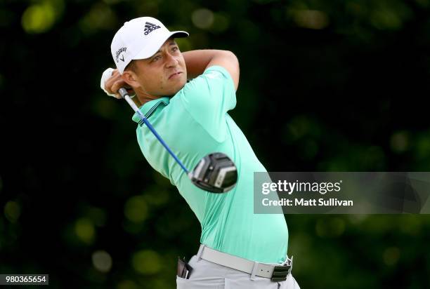 Xander Schauffele watches his tee shot on the 13th hole during the first round of the Travelers Championship at TPC River Highlands on June 21, 2018...