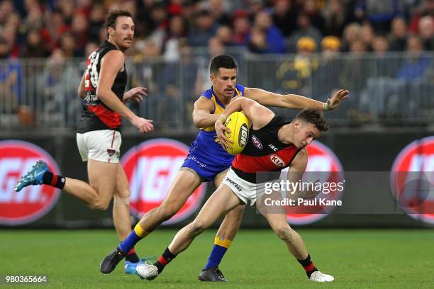 Orazio Fantasia of the Bombers Looks to break from Liam Duggan of the Eagles during the round 14 AFL match between the West Coast Eagles and the...