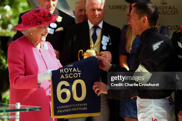 Queen Elizabeth II presents Frankie Dettori with his award for winning The Gold Cup on day 3 of Royal Ascot at Ascot Racecourse on June 21, 2018 in...