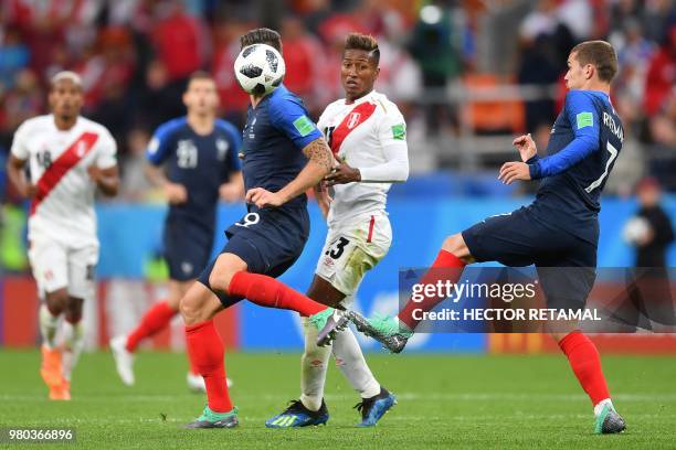 France's forward Olivier Giroud and Peru's midfielder Pedro Aquino compete for the ball during the Russia 2018 World Cup Group C football match...