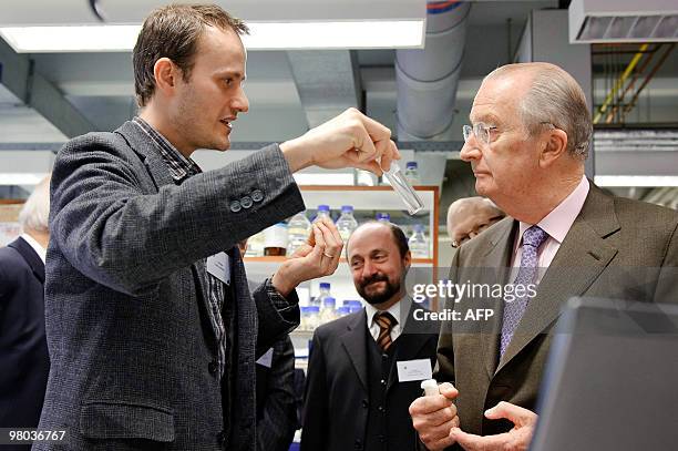 King Albert II of Belgium is given instructions during a visit at the 'Department of Human Genetics' in the Gasthuisberg site of the Katholieke...