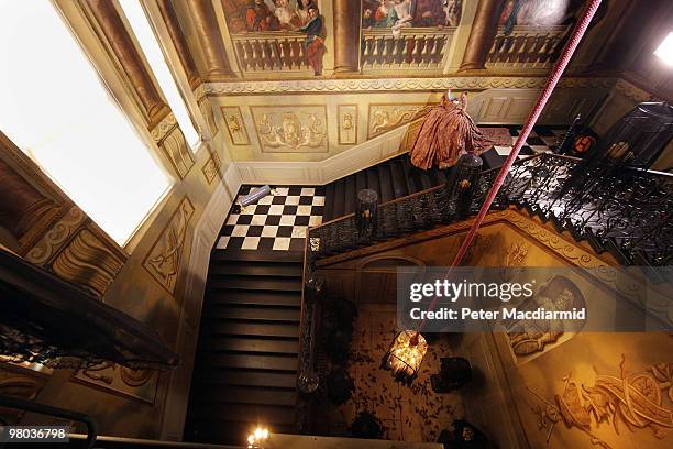 Dress by Vivienne Westwood stands at the top of the staircase in the Room of Flight the Enchanted Palace experience at Kensington Palace on March 25,...