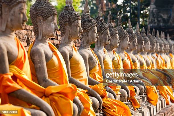 line of buddhas, wat yai chai mongkol, thailand - ayuthaya stock pictures, royalty-free photos & images