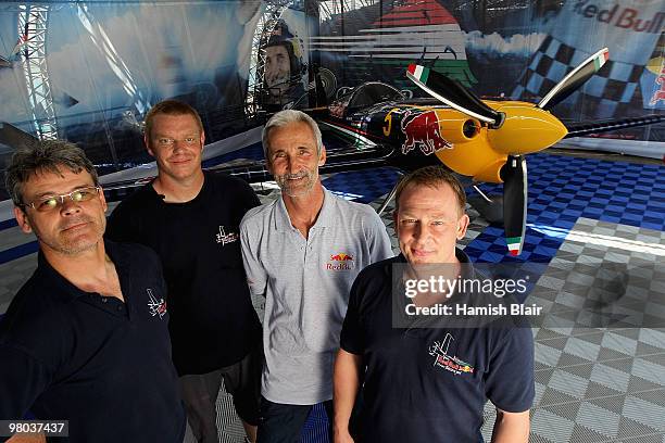 Peter Besenyei of Hungary poses with his team of technician Tibor Nagy technician Jim Reed and coordinator Sandor Kordas and their plane in the...