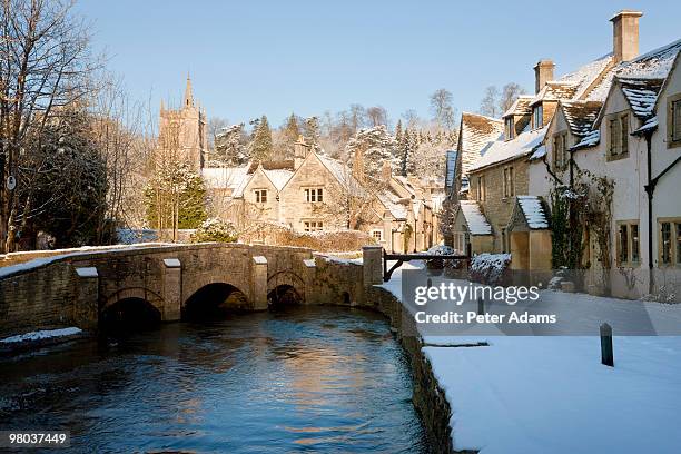 castle combe in the snow, wiltshire, england, uk - snowy village stock pictures, royalty-free photos & images