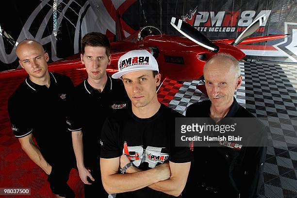 Pete McLeod of Canada poses with his team of technician Ted Reynolds coordinator Rob Hogan and McLeod's father Dave McLeod with their plane in the...