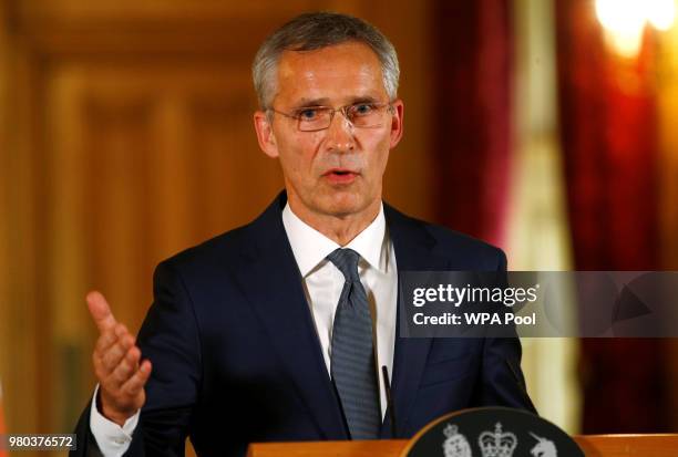 Secretary General of NATO Jens Stoltenberg speaks during a press conference with British Prime Minister Theresa May is seen during inside Number 10...