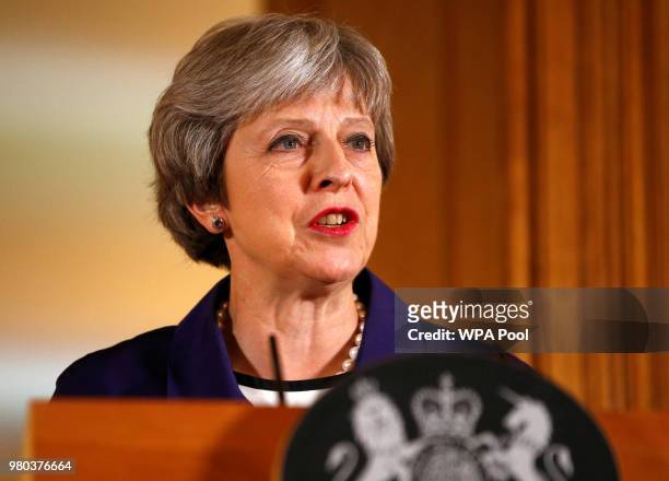 British Prime Minister Theresa May speaks during a press conference with Secretary General of NATO Jens Stoltenberg inside Number 10 Downing Street...