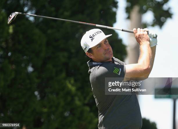 Keegan Bradley watches his tee shot on the ninth hole during the first round of the Travelers Championship at TPC River Highlands on June 21, 2018 in...