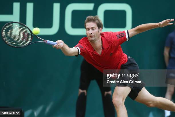 Florian Mayer of Germany returns a service to Andreas Seppi of Italy during their round of 16 match on day 4 of the Gerry Weber Open at Gerry Weber...