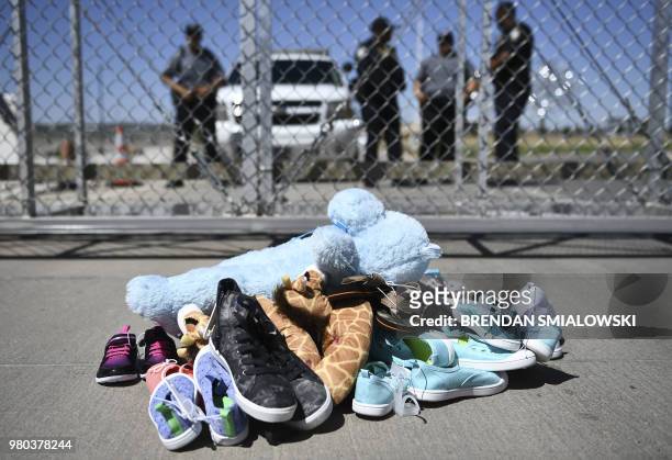 Shoes are left by people at the Tornillo Port of Entry near El Paso, Texas, June 21, 2018 during a protest rally by several American mayors against...