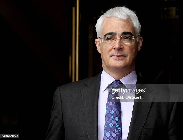 Chancellor of the Exchequer Alistair Darling leaves a television studio in Westminster a day after he delivered his Budget to Parliament on March 25,...
