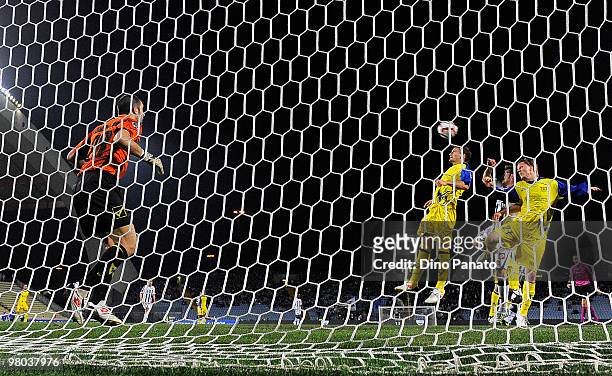 Stefano Sorrentino goal keeper of Chievo and Antonio Floro Flores of Udinese and Nicolas Frey and Santiago Morero of Chievo in action during the...