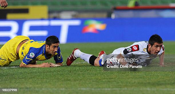 Giampiero Pinzi of Chievo and Mauricio Anibal Isla of Udinese lies on the pitch during the Serie A match between Udinese Calcio and AC Chievo Verona...