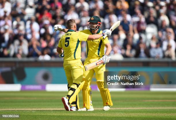 Aaron Finch is hugged by Shaun Marsh of Australia after scoring 100 runs during the 4th Royal London ODI match between England and Australia at...
