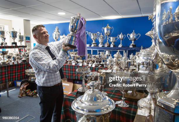 Alain Wright polishing the trophies holds the highest award The Queen's Cup at the Royal Highland Show on June 21, 2018 in Edinburgh, Scotland.