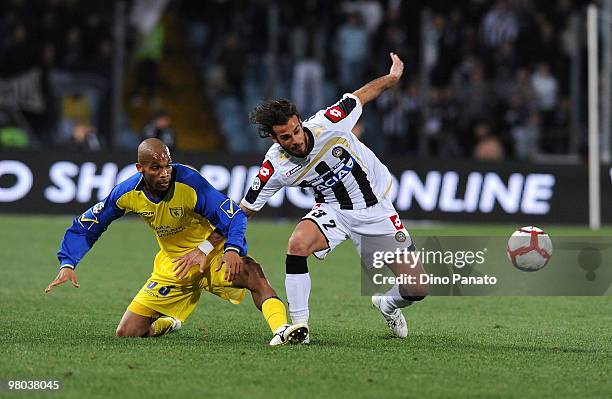 Marcos De Paula of Chievo competes with Damiano Ferronetti of Udinese during the Serie A match between Udinese Calcio and AC Chievo Verona at Stadio...