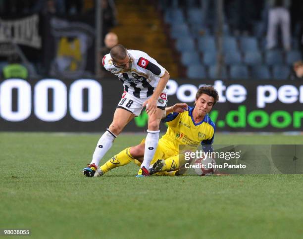 Gokhan Inler of Udinese competes with Simone Bentivoglio of Chievo during the Serie A match between Udinese Calcio and AC Chievo Verona at Stadio...