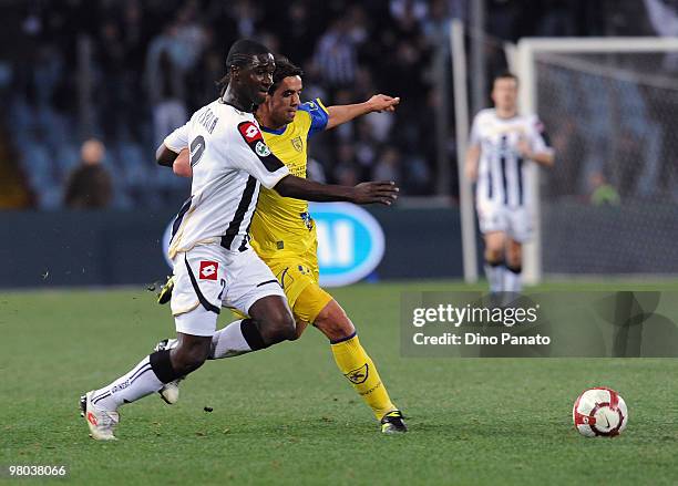 Cristian Zapata of Udinese competes with Pablo Granoche of Chievo during the Serie A match between Udinese Calcio and AC Chievo Verona at Stadio...