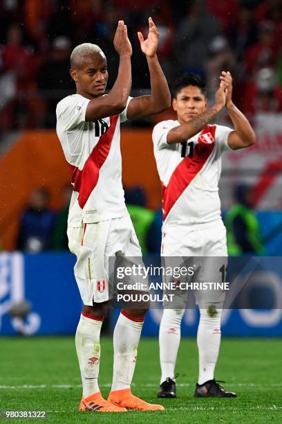 Peru's forward Andre Carrillo and Peru's forward Raul Ruidiaz applaud after the final whistle of the Russia 2018 World Cup Group C football match...