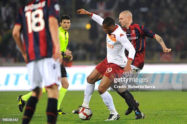 Julio Cesar Baptista of Roma competes with Andrea Rossi of Bologna during the Serie A match between Bologna FC and AS Roma at Stadio Renato Dall'Ara...