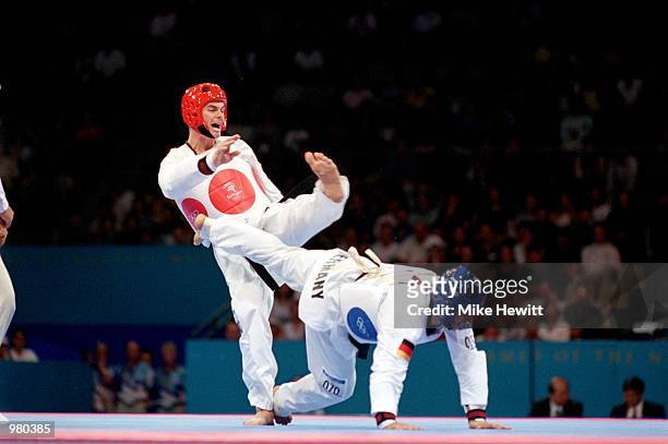 Warren Hansen of Australia and Faissal Ebnoutalib of Germany in action during the Men's 80kg Taekwondo held at the State Sports Centre during the...
