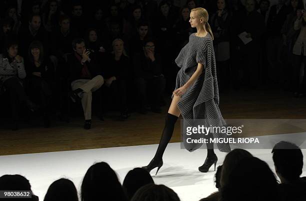 Model presents a creation by Portuguese fashion designer Luis Buchinho, on the second day of Portugal Fashion, in Porto, on March 20, 2010. AFP...