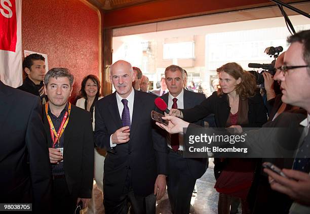 George Papandreou, Greece's prime minister, fourth left, arrives at the European Socialist Party meeting in Brussels, Belgium, on Thursday, March 25,...
