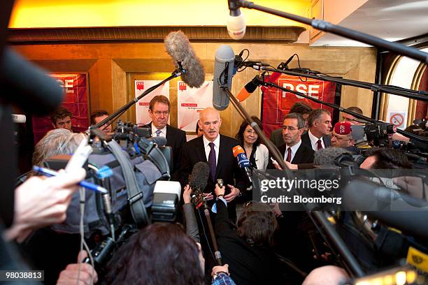 George Papandreou, Greece's prime minister, center, speaks to the media ahead of the European Socialist Party meeting in Brussels, Belgium, on...