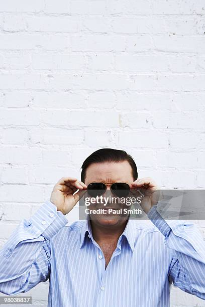 Actor & comedian Ricky Gervais poses for a portrait shoot for ES magazine in London on September 1, 2008.