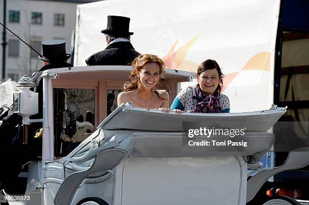 Actress Marie Zielcke and actress Anett Heilfort are seen in a carriage at Unter den Linden during their shooting for the SAT 1 daily soap 'Eine wie...