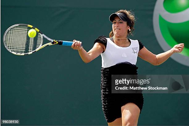 Aravane Rezai of France returns a shot against Petra Martic of Croatia during day three of the 2010 Sony Ericsson Open at Crandon Park Tennis Center...