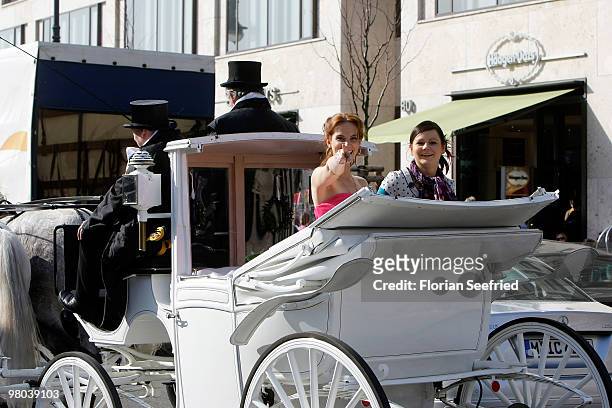 Actress Marie Zielcke and actress Anett Heilfort are seen in a carriage at Unter den Linden during their shooting for the SAT 1 daily soap 'Eine wie...