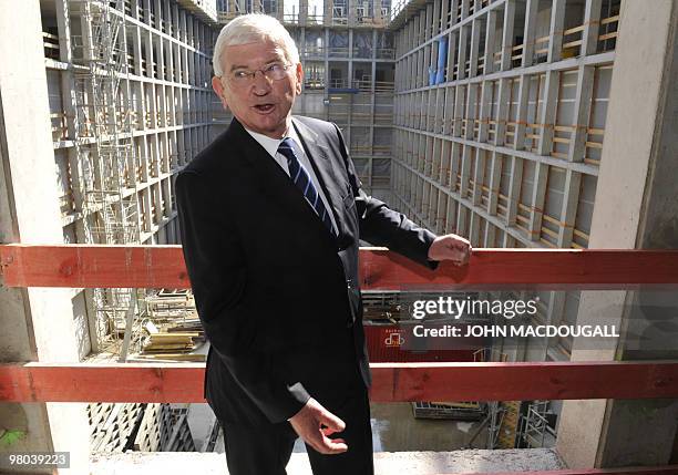 Ernst Uhrlau, head of the German intelligence service, the BND, poses for photographers as he attended a topping-out ceremony for the new German...