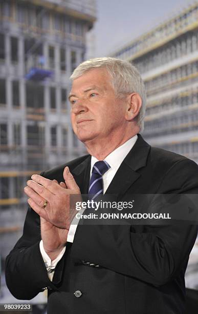 Ernst Uhrlau, head of the German intelligence service, the BND, applauds a speech, as he attended a topping-out ceremony for the new German...