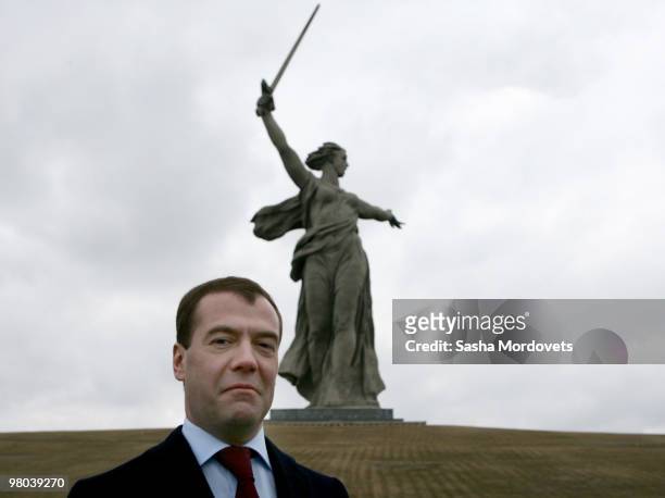 Russian President Dmitry Medvedev poses in front of 'The Motherland Calls' statue during his visit to Volgograd , on March 25, 2010 in Vogograd,...