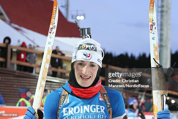 Marie Laure Brunet of France celebrates after the women's sprint in the E.On Ruhrgas IBU Biathlon World Cup on March 25, 2010 in Khanty-Mansiysk,...