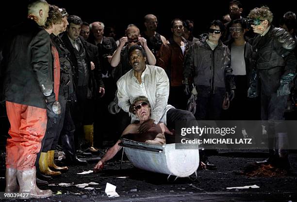 Gregg Baker as Amfortas , Matthias Hoelle as Titurel and choral members perform in the opera "Parsifal" by Richard Wagner during a photo rehearsal on...