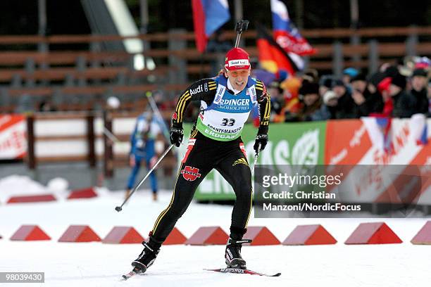 Kati Wilhelm of Germany competes with a "Thank you" sign on her hat during the women's sprint in the E.On Ruhrgas IBU Biathlon World Cup on March 25,...