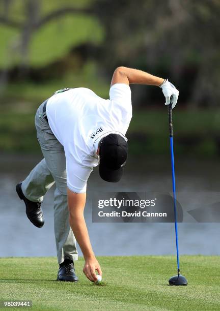 Henrik Stenson of Sweden takes his driver for his tee shot at the 16th hole but without using a tee peg instead he used his wedge to create a tuft of...