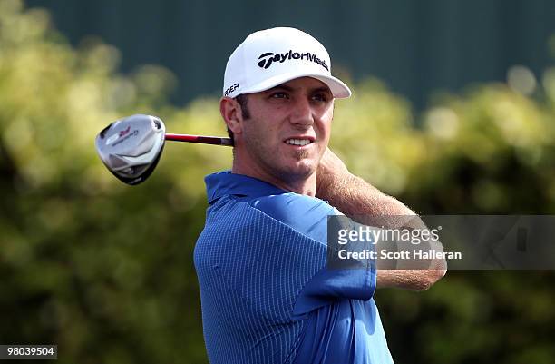 Dustin Johnson hits a shot on the ninth tee during the first round of the Arnold Palmer Invitational presented by MasterCard at the Bayhill Club and...