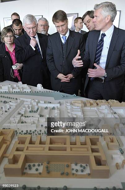 Architect Jan Kleihues shows a model of the building to Ernst Uhrlau , head of the German intelligence service, the BND, and German Chief of Staff...