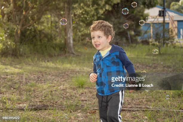 chasing bubbles - lianne loach stock-fotos und bilder