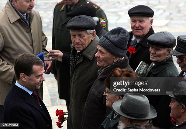 Russian President Dmitry Medvedev meets veterans of World War II during his visit to Mamayev Hill Eternal Flame war memorial, on March 25, 2010 in...